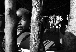 Child peeps through the unfinished wall